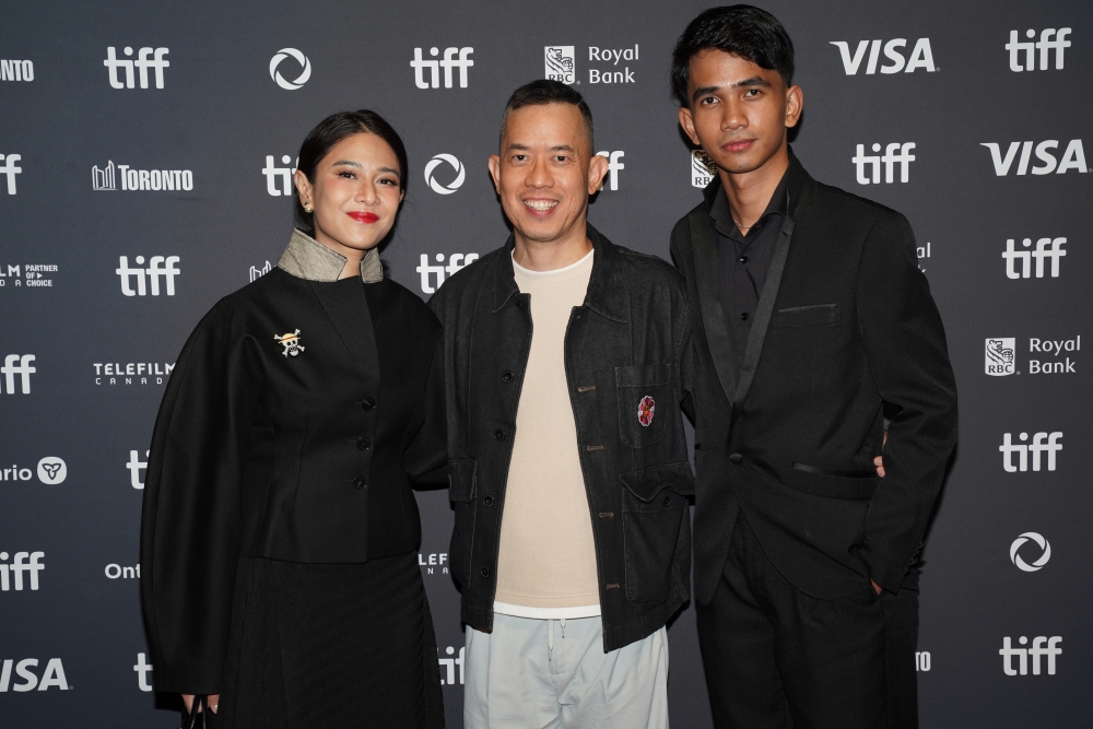 ‘The Fox King’ cast and crew (from left) Indonesian actress Dian Sastrowardoyo, Malaysian director Woo Ming Jin, and Malaysian actor Idan Aedan, attend the film’s world premiere at the 50th Toronto International Film Festival on September 11, 2025. — Picture courtesy of Da Huang Pictures