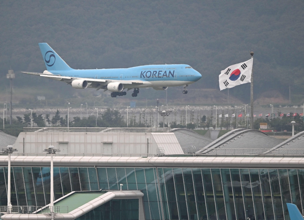 A chartered Korean Air Boeing 747-8I plane carrying hundreds of South Korean workers freed after a US immigration raid lands at Incheon airport in Seoul on September 12, 2025. — AFP pic