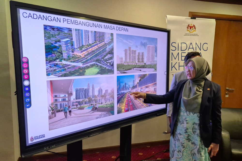 Minister in the Prime Minister’s Department (Federal Territories) Datuk Seri Dr Zaliha Mustafa points to slide during a press conference in Putrajaya September 12, 2025. — Bernama pic
