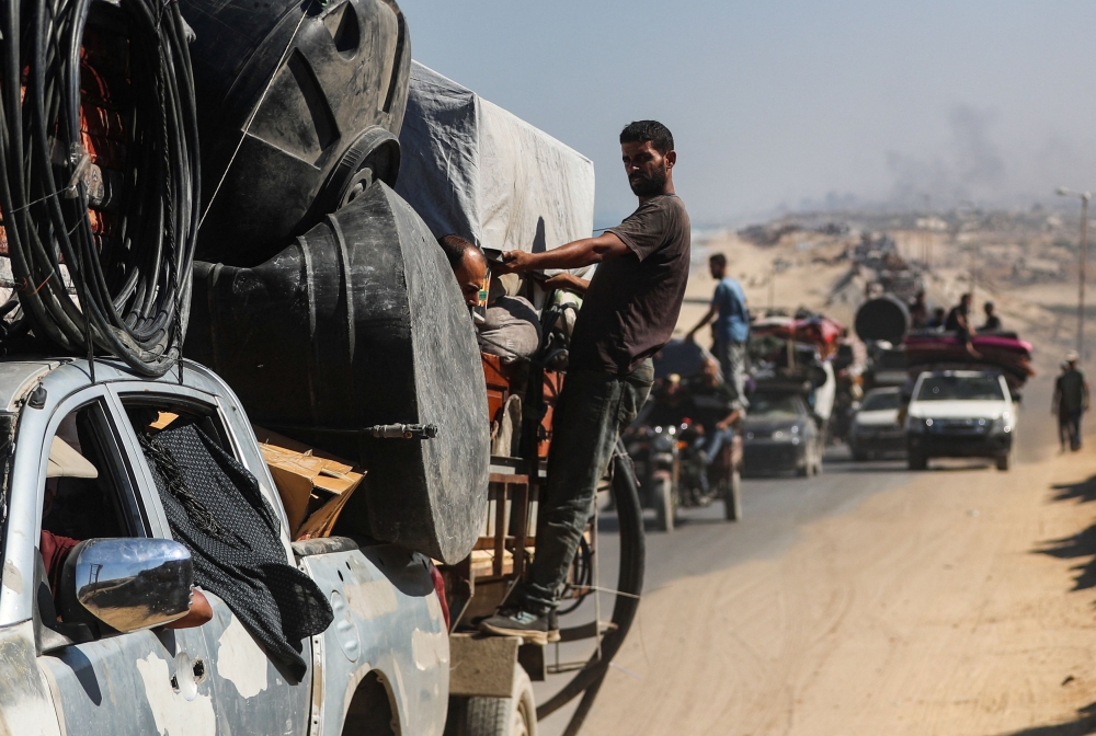 Displaced Palestinians, fleeing northern Gaza due to an Israeli military operation, move southward after Israeli forces ordered residents of Gaza City to evacuate to the south, in the central Gaza Strip, September 12, 2025. — Reuters pic 