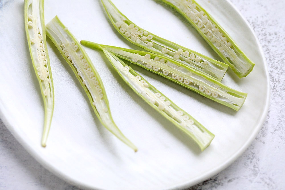 Slice each okra lengthwise. — Picture by CK Lim
