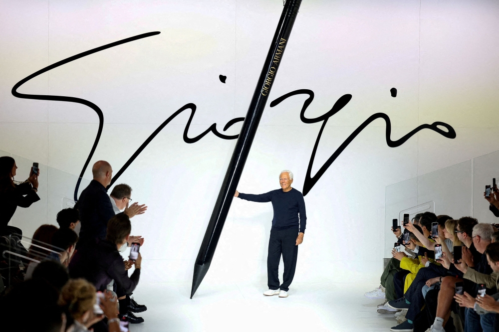 In this file photo taken on June 19, 2023, Italian designer Giorgio Armani poses at the end of his Spring/Summer 2024 men’s collection show during Fashion Week in Milan. — Reuters pic