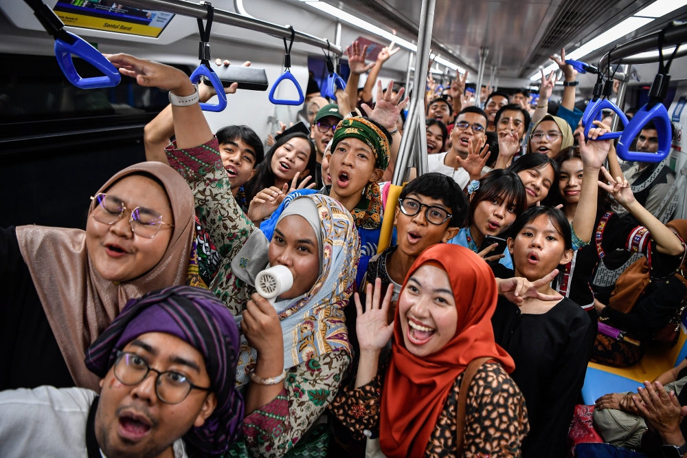 Participants wearing sarongs and traditional attire join the Keretapi Sarong 2025 programme at the Sri Damansara Sentral MRT station in Kuala Lumpur September 13, 2025. — Bernama pic