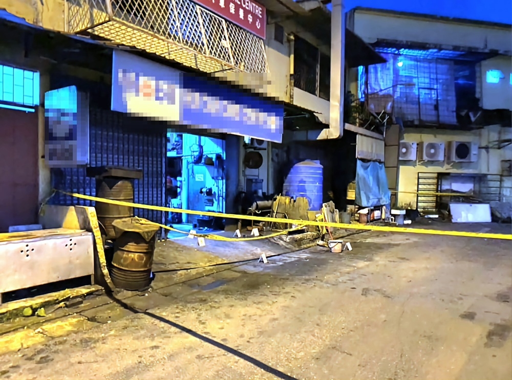 The scene of the explosion, which has since been cordoned off by the police for their investigation. — The Borneo Post pic 
