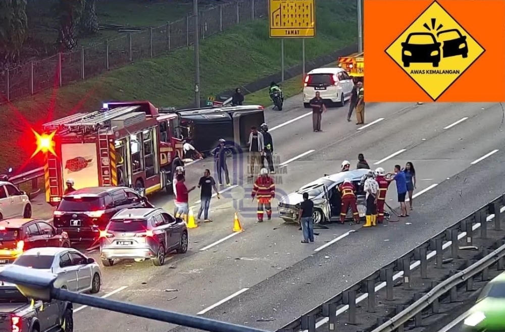 Emergency personnel at the scene of the accident at Kilometre 276 of the North-South Expressway this morning. — Picture via Facebook/Lembaga Lebuhraya Malaysia