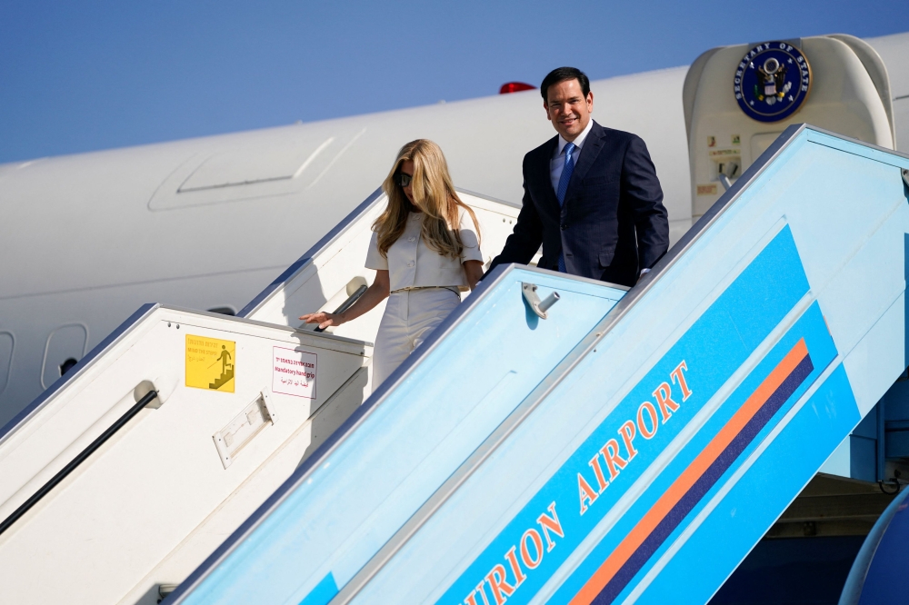 US Secretary of State Marco Rubio and his wife Jeanette Dousdebes arrive at Ben Gurion International Airport, near Lod, Israel, September 14, 2025. — Reuters pic  