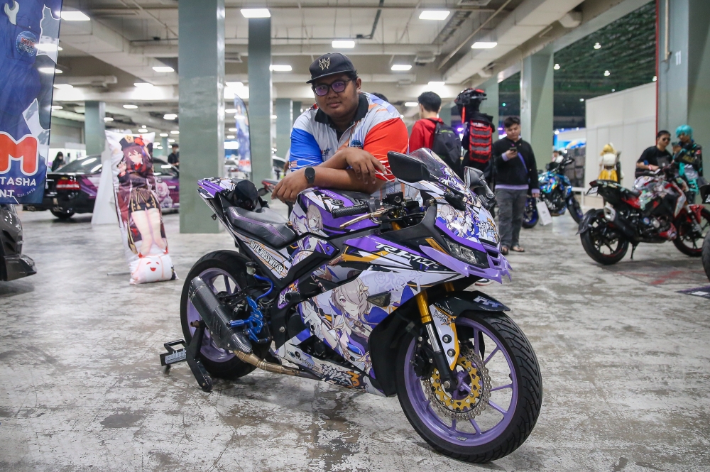 Muhammad Zulfiqar posing with his itansha decorated with the character Rita Rossweisse from Honkai impact 3rd during AniManGaki 2025. —  Picture by Yusof Isa