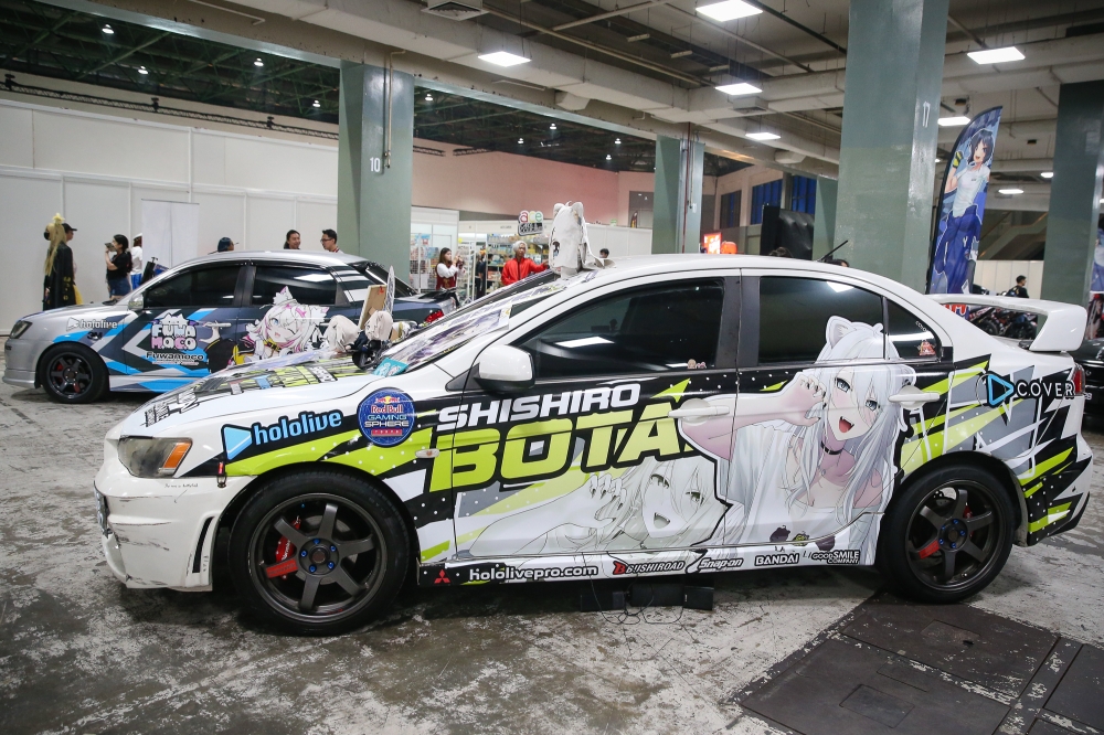 Itashas featuring hololive production VTuber Shishiro Botan and VTubers FUWAMOCO (in the back) during AniManGaki 2025. — Picture by Yusof Isa