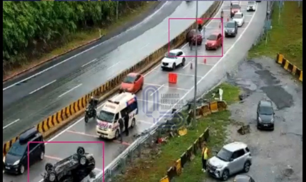 The crash occurred when the Nissan Almera, driven by a 27-year-old woman, lost control while in the right lane, skidded to the left, crashed into a guardrail and overturned. — Screengrab from Facebook/Info Trafik Perak