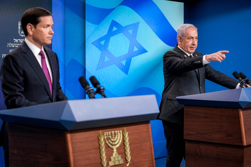 US Secretary of State Marco Rubio (left) looks on as Israel's Prime Minister Benjamin Netanyahu (right) takes a question during a joint press conference at the Prime Minister's Office in Jerusalem on September 15, 2025. — AFP pool pic