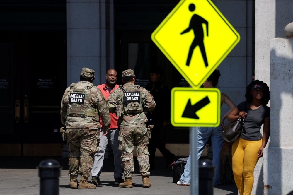 Members of the National Guard patrol outside Union Station, weeks after US President Donald Trump deployed the National Guard and ordered an increased presence of federal law enforcement to assist in crime prevention, in Washington, D.C. September 15, 2025. — Reuters pic 