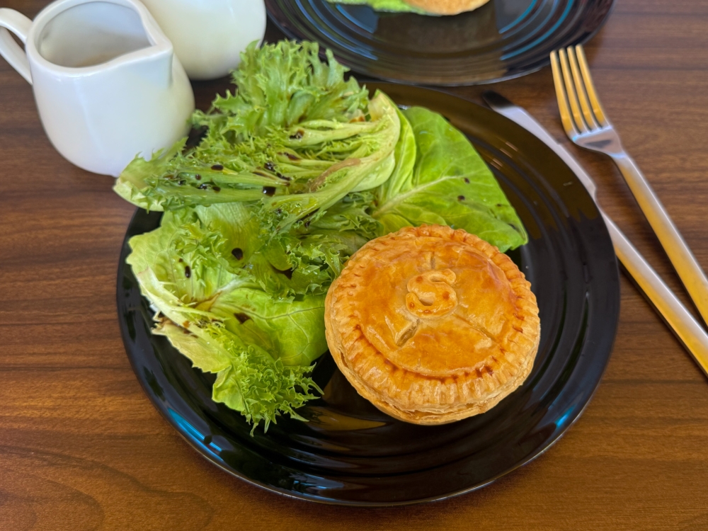 S marks the Beef Steak & Cheese Pie with a mix of shortcrust and puff pastries encasing a generous filling. — Picture by Lee Khang Yi