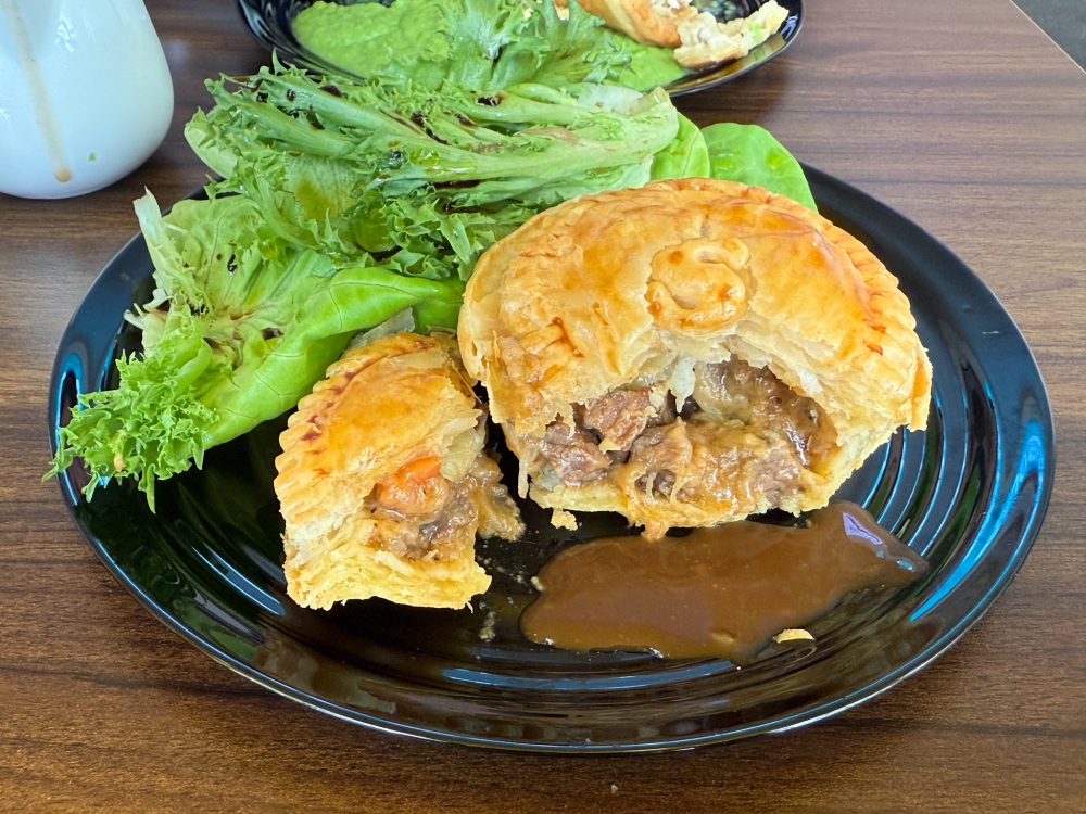 Inside, there are small chunks of beef, stewed till tender with mushrooms, carrots, onions and herbs, together with cheese. — Picture by Lee Khang Yi