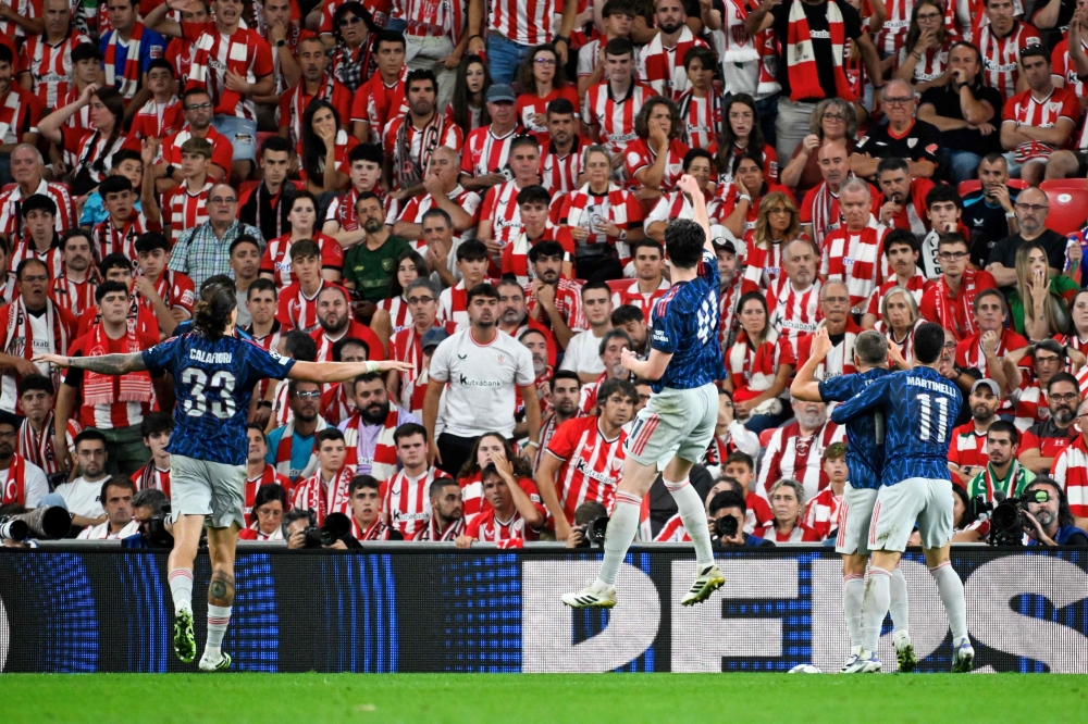 Arsenal's Belgian forward #19 Leandro Trossard (2nd right) celebrates with teammates scoring his team's second goal during the Uefa Champions League first round day 1 football match between Athletic Club Bilbao and Arsenal at the San Mames stadium in Bilbao on September 16, 2025. — AFP pic 