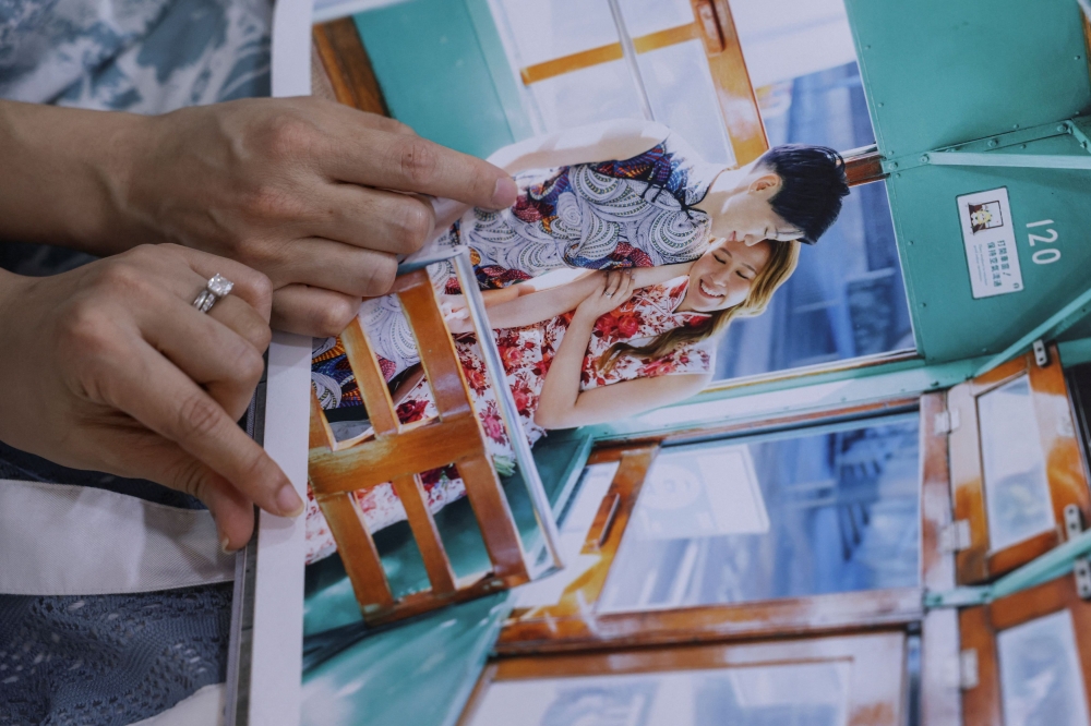 Gloria Tsang, a 33-year-old speech therapist, and her wife Jaedyn Yu, a 35-year-old drum school owner, show their wedding photo in their studio in Hong Kong September 12, 2025. — Reuters pic