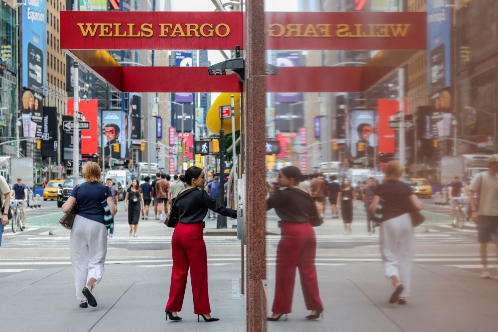 A person enters a Wells Fargo branch in New York City July 18, 2025. A Wells Fargo banker, Chenyue Mao, who had been barred from leaving China for several months, has been allowed to return to the United States following negotiations between US and Chinese officials, according to two people with knowledge of the case. — Reuters pic 