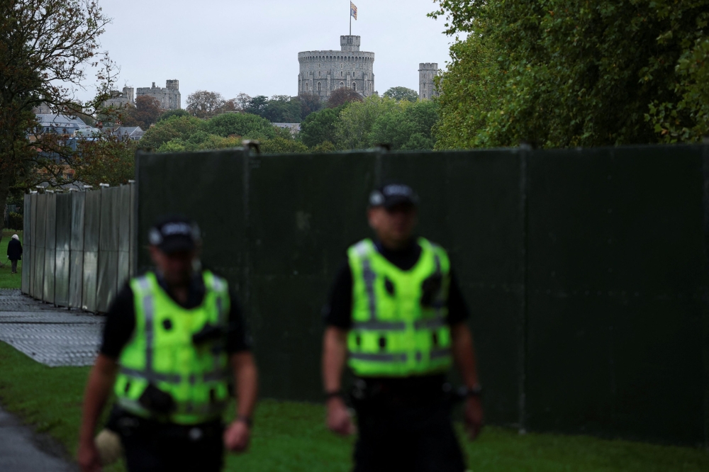 Police officers walk near Windsor Castle on the day of the state visit of US President Donald Trump and first lady Melania Trump, in Windsor, Britain, September 17, 2025. — Reuters pic 