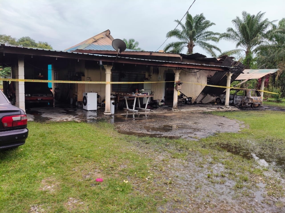 The home in Kampung Tengah, Muar, after it was allegedly set on fire by the elderly homeowner’s son after he assaulted his father yesterday. — Picture courtesy of Muar district police