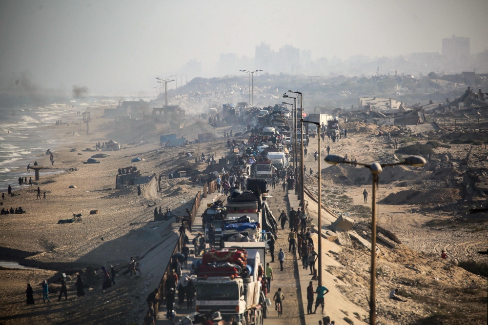 Displaced Palestinians move with their belongings southwards on a road in the Nuseirat refugee camp area in the central Gaza Strip following renewed Israeli evacuation orders for Gaza City September 18, 2025.  — AFP pic 