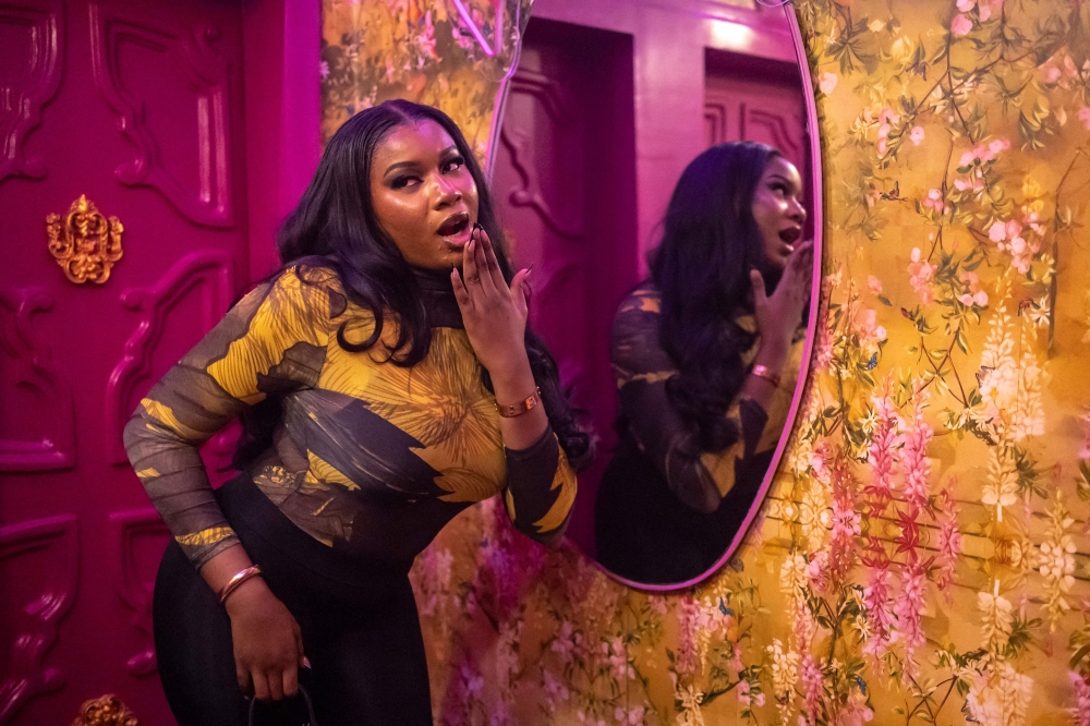 A patron poses for a photograph inside the restroom of Zaza restaurant and lounge in Lagos, on August 23, 2025. — AFP pic
