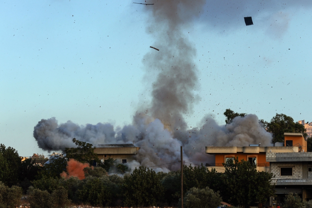 Smoke billows amid Israeli strikes in the southern Lebanese village of Kfar Tibnit on September 18, 2025. — AFP pic 