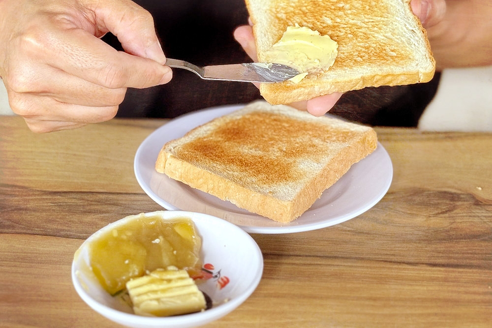 'Roti bakar' with 'kaya' and butter on the side.