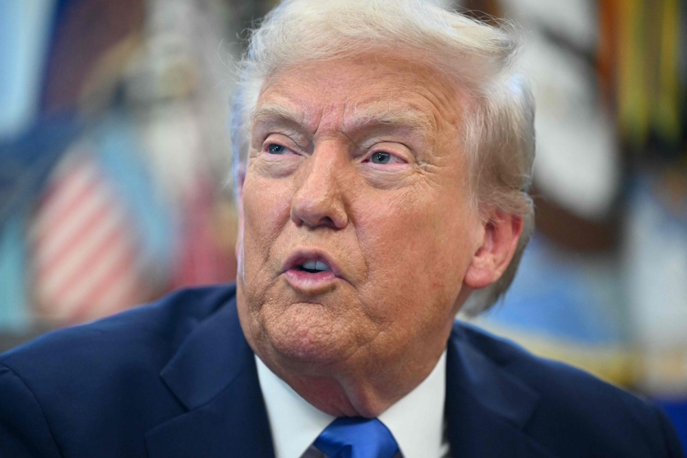 US President Donald Trump speaks before signing executive orders in the Oval Office at the White House in Washington, DC, on September 19, 2025.  — AFP pic