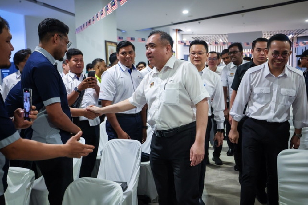 Transport Minister Anthony Loke greets attendees at the launch of the 2025 Professional Advancement in Trucking and Haulage (PATH) Programme at Penang Port in Butterworth September 20, 2025. — Bernama pic