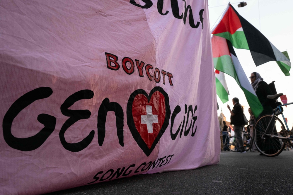 Protesters hold a banner reading ‘Basel — Unite for Palestine (unseen), boycott genocide’ during a silent demonstration in support of the Palestinian people on the day of the commemoration of the ‘Nakba’, the Palestinian people’s displacement during the creation of Israel, in Basel, on May 14, 2025. — AFP pic