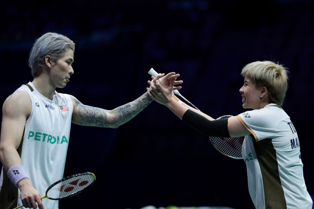 Malaysia’s Toh Ee Wei and Chen Tang Jie celebrate a point during their mixed doubles semi-final match against China’s Feng Yanzhe and Huang Dongping at the China Masters 2025 in Shenzhen September 20, 2025. — AFP pic