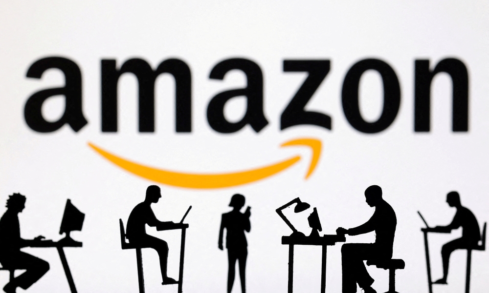 Amazon has told its H-1B staff abroad to return to the US within 24 hours or stay put as Trump’s US$100,000 visa fee shocks tech giants. — Reuters pic