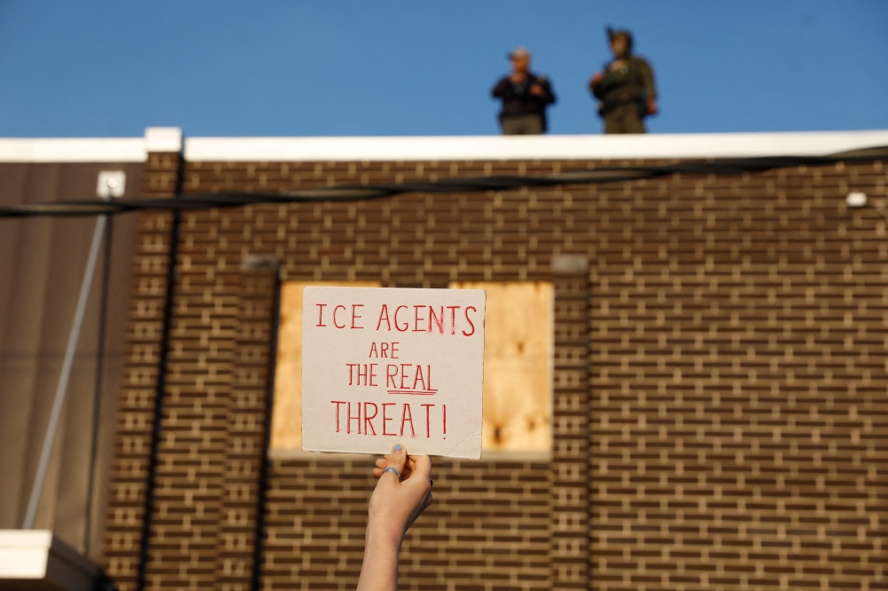 Pro-immigration demonstrators react toward federal law enforcement officers during a protest outside an Immigration and Customs Enforcement (ICE) processing center in Broadview, Illinois, on September 19, 2025. — AFP pic 