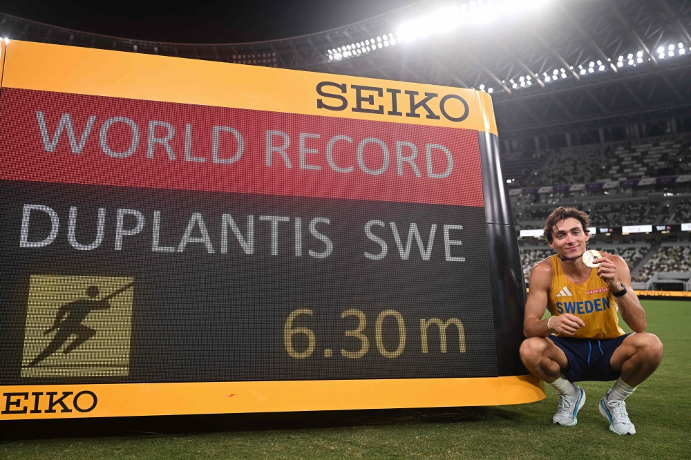 Gold medallist Armand Duplantis celebrates his new world record in the men’s pole vault final during the World Athletics Championships in Tokyo September 15, 2025. — AFP pic