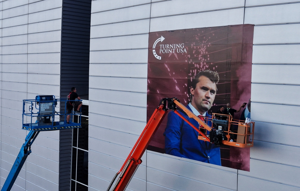 A drone view of workers installing a photo of slain conservative commentator Charlie Kirk, ahead of a memorial service to be held for him on September 21 at State Farm Stadium, in Glendale, Arizona September 19, 2025. — Reuters pic 