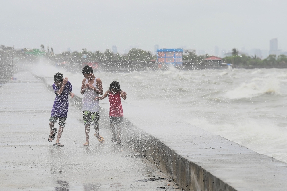 File picture of Typhoon Doksuri passing the northern tip of Luzon island in the Philippines July 26, 2023. Hundreds of families sheltered in schools and evacuation centres today as heavy rains and gale-force winds from Super Typhoon Ragasa lashed the northern Philippines and southern Taiwan. — AFP pic