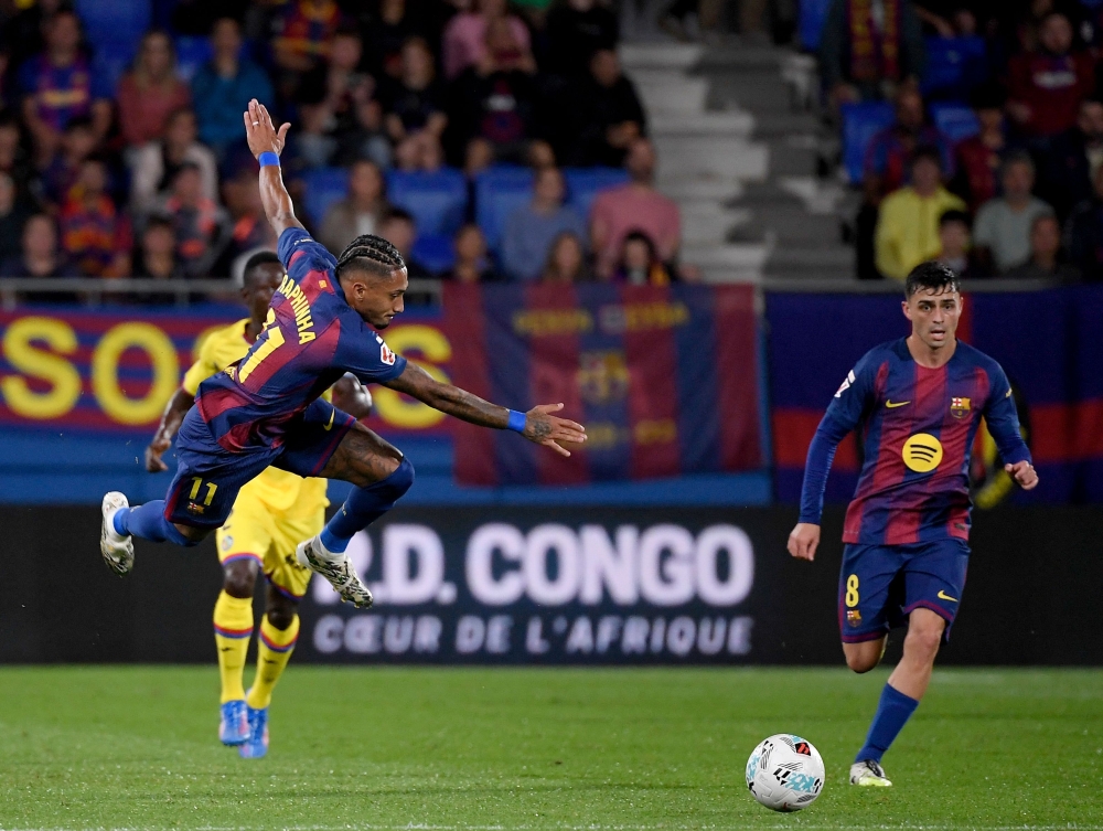 Barcelona's Brazilian forward #11 Raphinha fights for the ball during the Spanish league football match between FC Barcelona and Getafe CF at Johan Cruyff Stadium in Barcelona September 21, 2025. — AFP pic 
