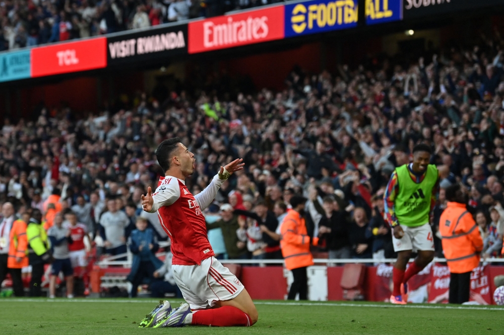 Arsenal's Brazilian midfielder #11 Gabriel Martinelli celebrates after scoring their first goal during the English Premier League football match between Arsenal and Manchester City at the Emirates Stadium in London on September 21, 2025. — AFP pic 