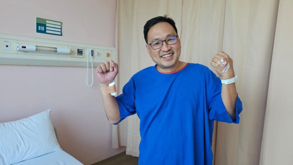 Chong is seen smiling after the successful operation to clear a blocked artery, in this photo from his Facebook page.