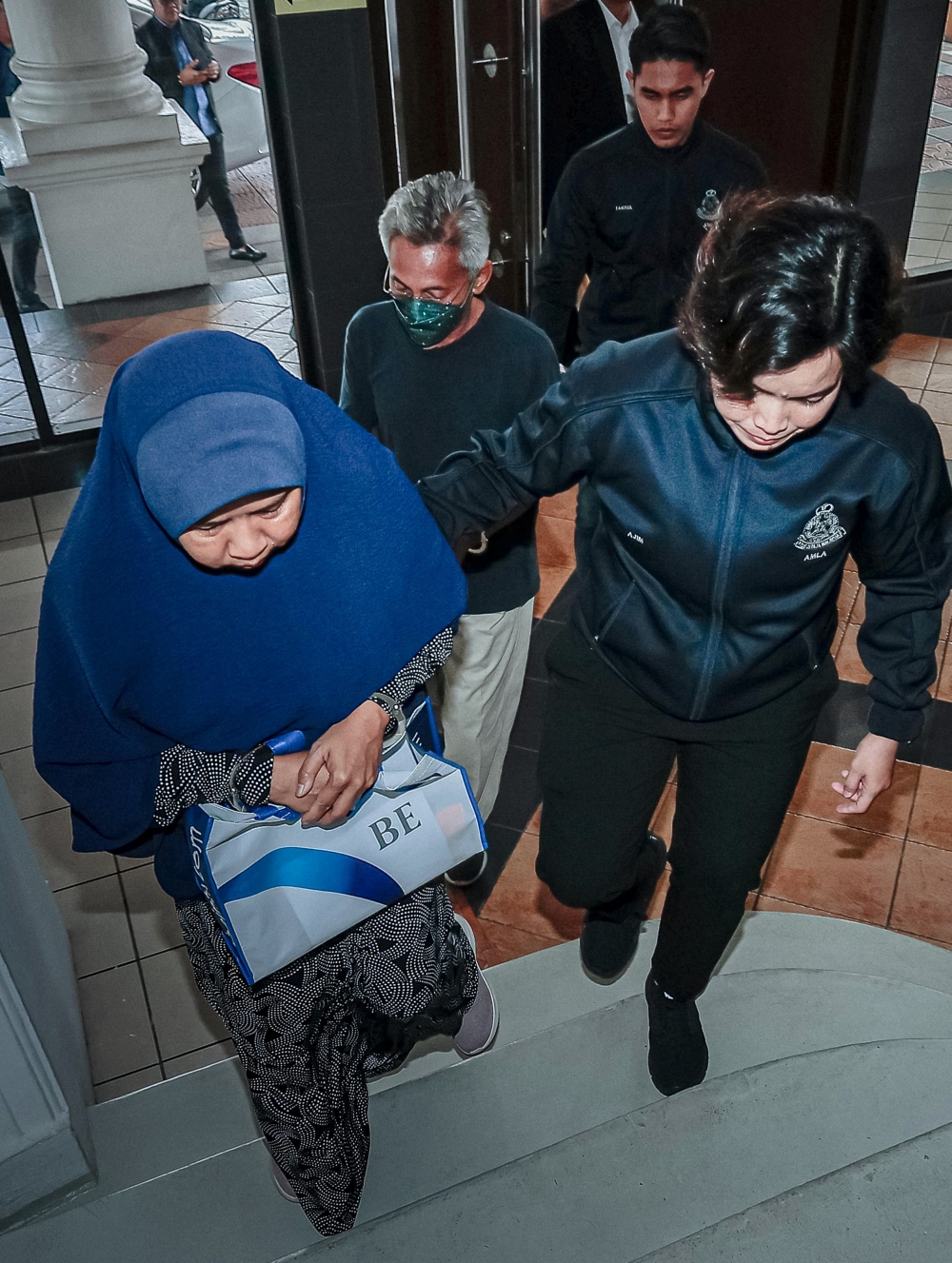 A married couple was charged in the Sessions Court here today with 75 counts of unlicensed deposit-taking, promoting an unregistered investment scheme, and money laundering involving more than RM52.89 million between 2016 and 2024. — Bernama pic