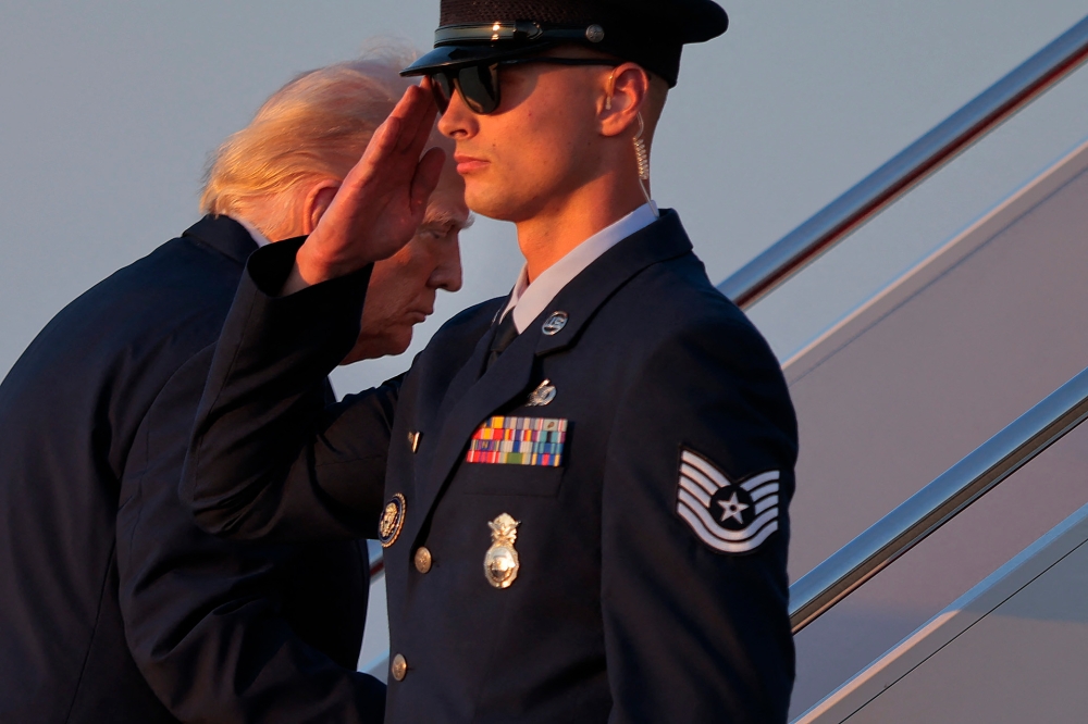 US President Donald Trump boards Air Force One on the tarmac at Joint Base Andrews, Maryland, September 22, 2025. — AFP pic