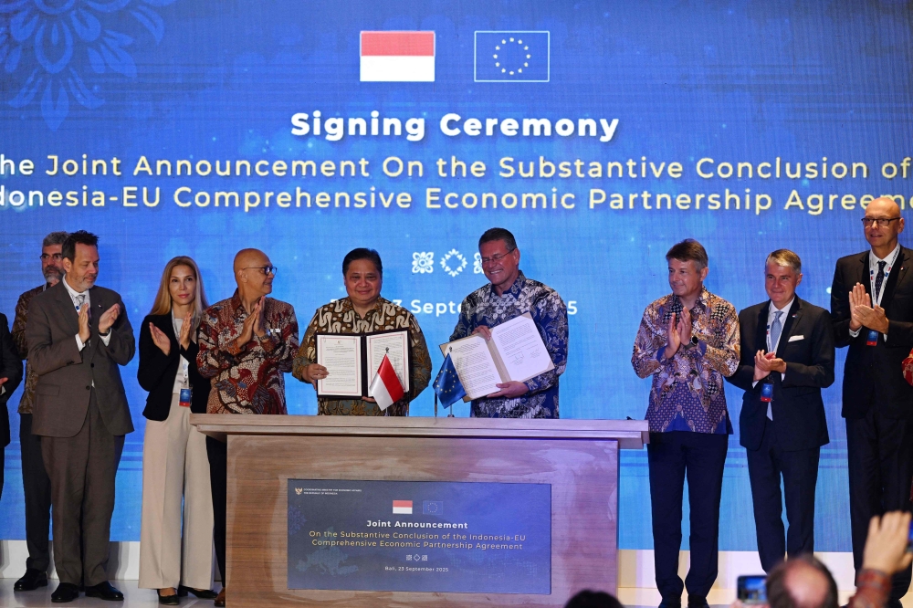 Indonesia’s Coordinating Minister for Economic Affairs Airlangga Hartarto and EU Commissioner for Trade and Economic Security, Interinstitutional relations and Transparency Maros Sefcovic hold their signed joint announcements on the Substantial Conclusion of the Indonesia-EU Comprehensive Economic Partnership Agreement in Bali September 23, 2025. — AFP pic