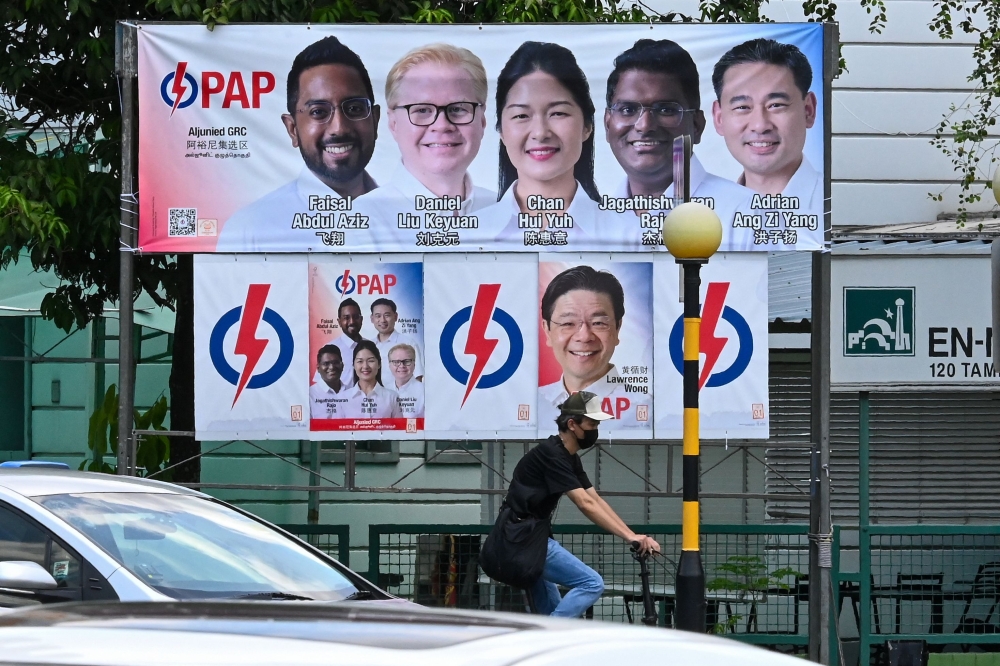 Election campaign posters for the ruling People’s Action Party are pictured in Singapore April 30, 2025. — AFP pic