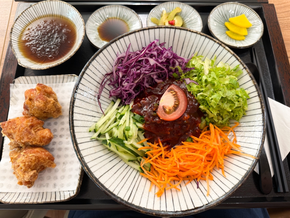 Bibim Soba brings the familiar ‘gochujang’ flavour with a mountain of good-for-you vegetables that can be paired with juicy Chicken Karaage. — Picture by Lee Khang Yi