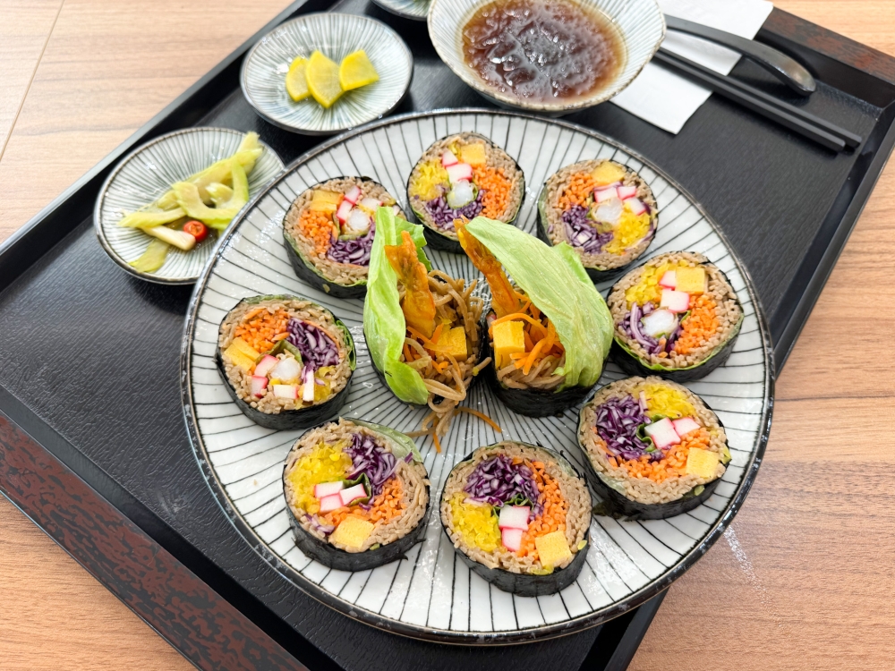 Soba Shrimp Maki is a twist to tradition, using soba instead of rice for the seaweed roll stuffed with tempura prawn, pickled radish, purple cabbage, carrots and ‘kamakobo’. — Picture by Lee Khang Yi