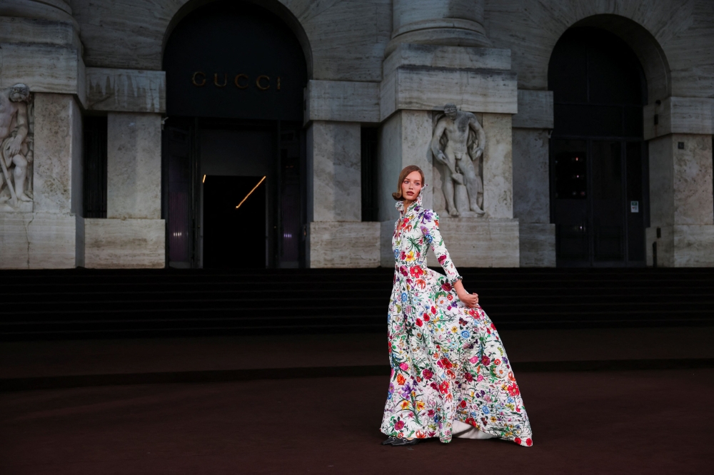 A model wears a Gucci creation as people arrive for Gucci’s exclusive screening of ‘The Tiger’, a short film directed by Spike Jonze and Halina Reijn during Milan Fashion Week, in Milan September 23, 2025. — Reuters pic