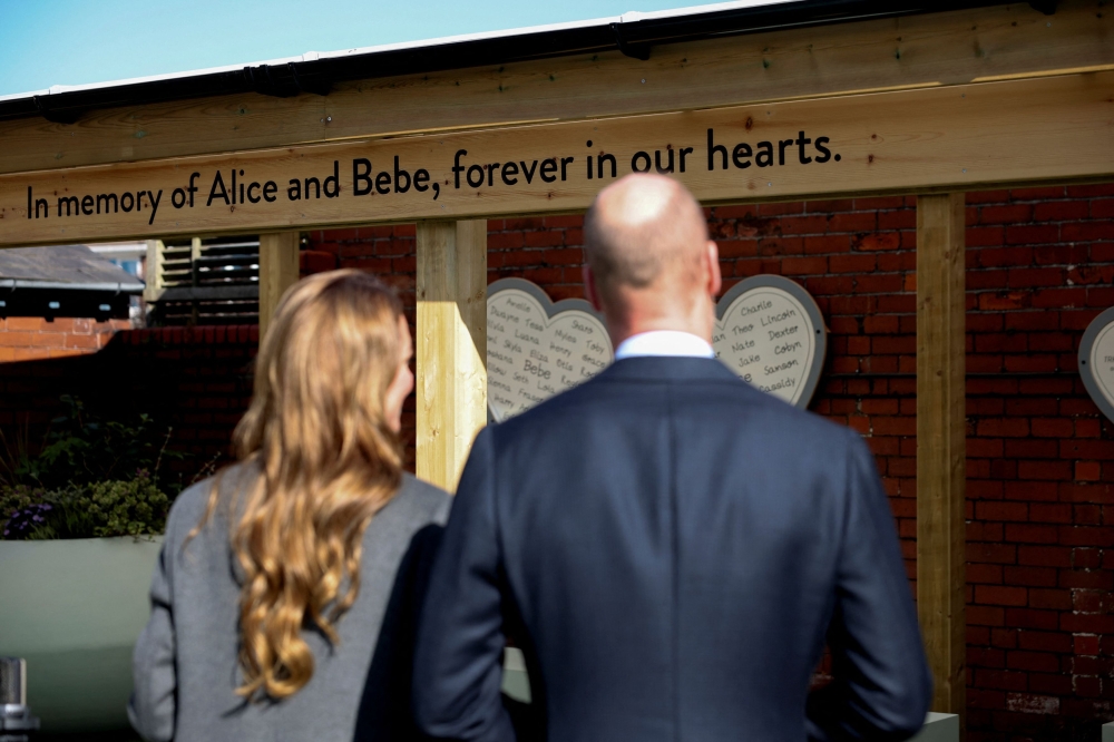 Britain’s Prince William, Prince of Wales and Catherine, Princess of Wales view the new commemorative playground at Churchtown Primary School, created in memory of former pupils Bebe King and Alice da Silva Aguiar. — Reuters pic