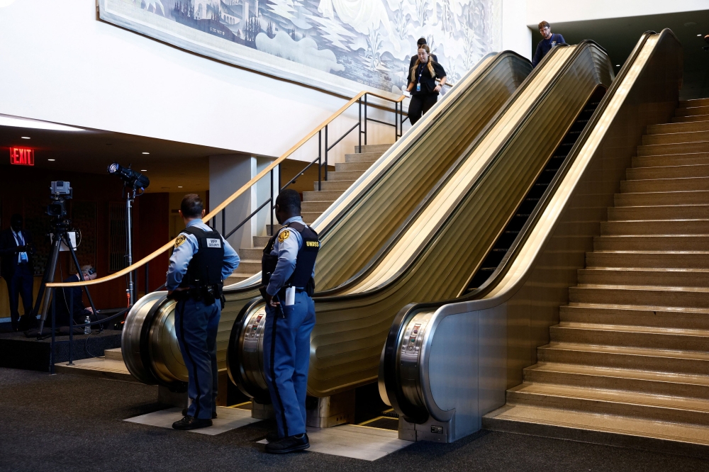 Security perosnel stand next to an escalator on the day of the 80th United Nations General Assembly at UN headquarters in New York City September 23, 2025. — Reuters pic  