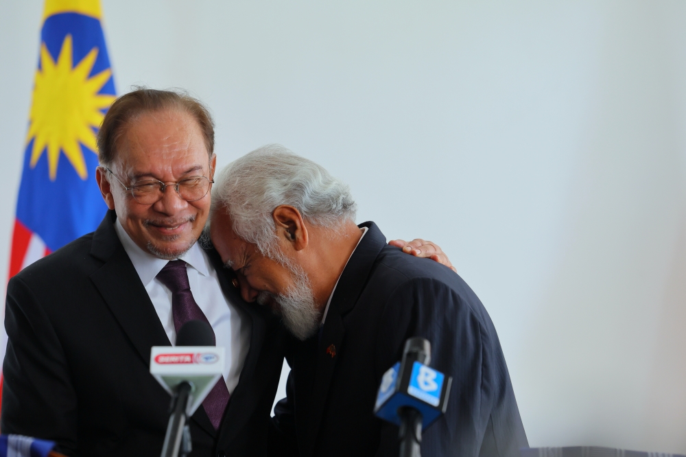 Prime Minister Datuk Seri Anwar Ibrahim and Prime Minister of Timor-Leste Kay Rala Xanana Gusmão react during a joint press conference after a bilateral meeting at the Government Palace in Dili on Sept 24, 2025. — Bernama pic