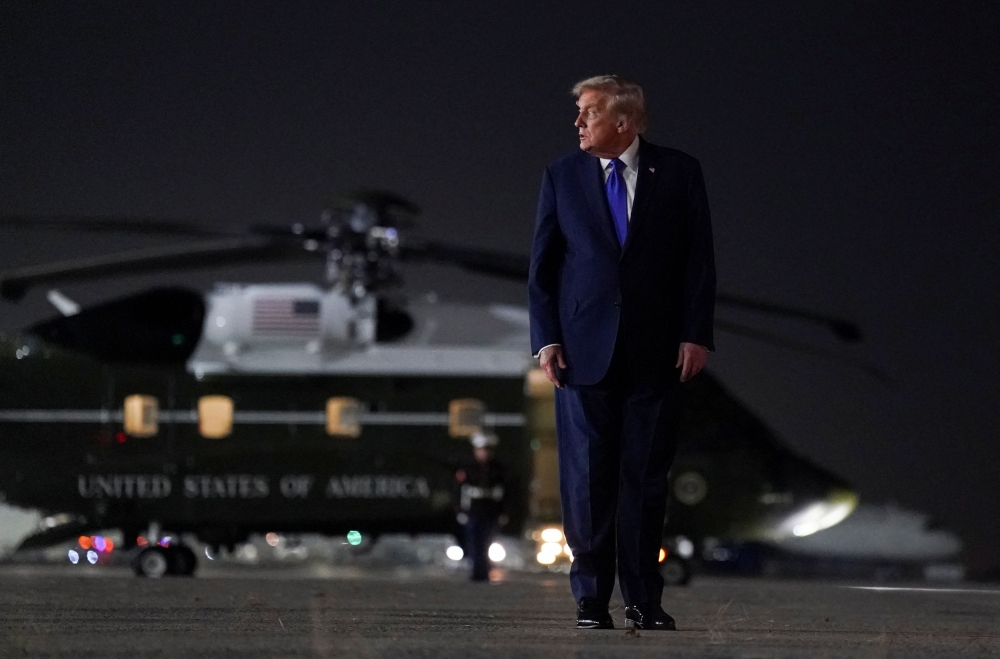 US President Donald Trump looks on as he walks to board Air Force One, after attending the 80th United Nations General Assembly, at John F. Kennedy International Airport, in New York, September 23, 2025. — Reuters pic 