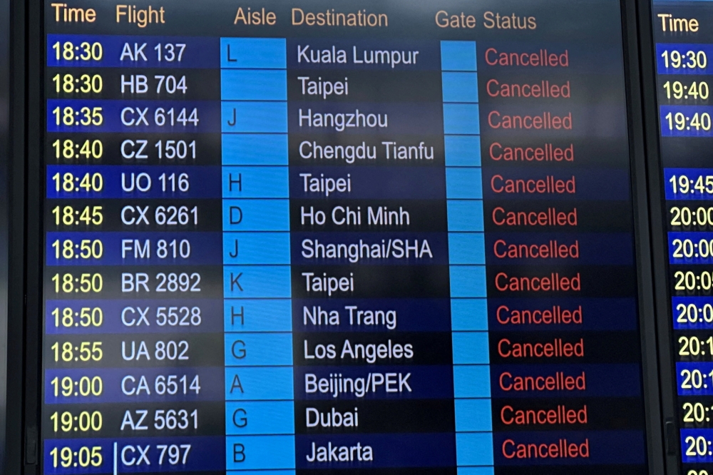 A departure board displays flight cancellations at Hong Kong International Airport, as Super Typhoon Ragasa disrupts travel, in Hong Kong September 23, 2025.— Reuters pic  